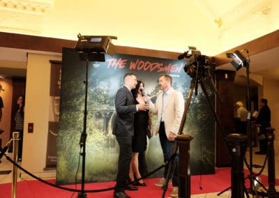 An interview with the Woodsmen team in front of the backdrop